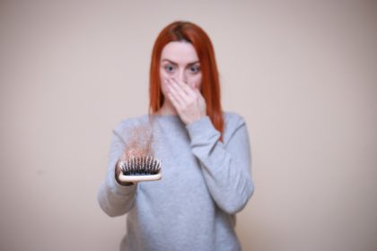 woman losing hair